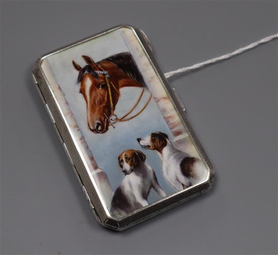 A Continental 935 white metal and enamelled cigarette case decorated with a horse and two hounds in a doorway, 74mm,